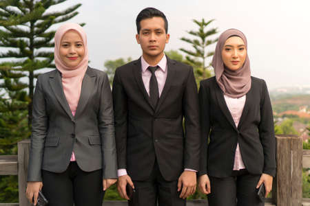 Group of Young Asian Malay Executive at the park wearing suit outdoorの写真素材