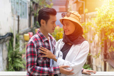 Travel Concept, Muslim Tourist Couple at Kuala Lumpur looking at each otherの写真素材