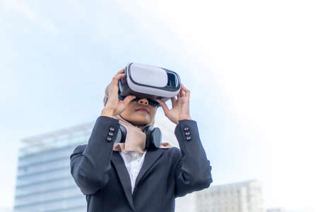 Cute Malay Woman wearing vr google and headset outdoor