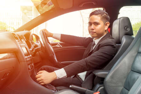 E-Hailing Concept, young asian man driving a car