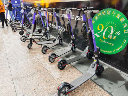 KUALA LUMPUR, MALAYSIA - NOVEMBER 23, 2019: Electric scooters properly parked at a street at Kuala...