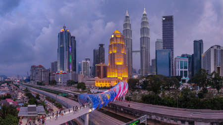 KUALA LUMPUR, MALAYSIA, FEBRUARY 9 2020 : A newly built pedestrian bridge named Lintasan Saloma near Kuala Lumpur Petronas Twin Tower (KLCC). This bridge have unique design based Malay cultureのeditorial素材