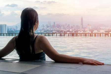 Travel Concept, Swimming pool on roof top with beautiful city view Kuala Lumpur malaysiaの写真素材