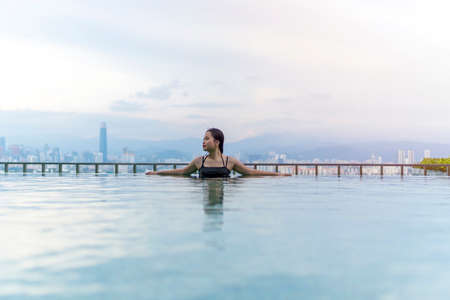 Travel Concept, Swimming pool on roof top with beautiful city view Kuala Lumpur malaysiaの写真素材