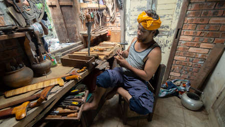 Local demonstrate on making art of crafting Malay Traditional asymmetrical Dagger called "Keris"の写真素材