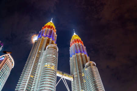 KUALA LUMPUR, MALAYSIA, AUGUST 30 2020 : KLCC Twin Tower lighted up with beautiful national flag colours celebrating independence dayのeditorial素材