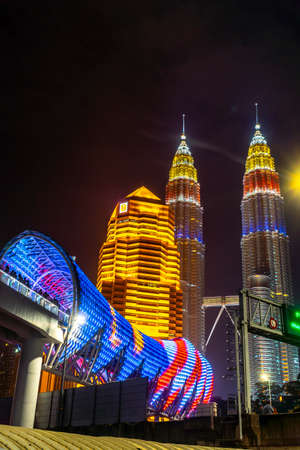 KUALA LUMPUR, MALAYSIA, AUGUST 30 2020 : KLCC Twin Tower lighted up with beautiful national flag colours celebrating independence dayのeditorial素材