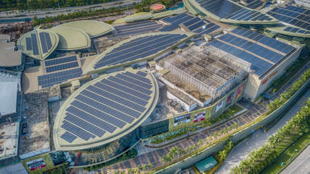 PUTRAJAYA, MALAYSIA - DECEMBER 8, 2020: Solar panel on top of high commercial building. Solar Panel uses photo-voltaic cells use sunlight as a source of energy and generate direct current electricityのeditorial素材
