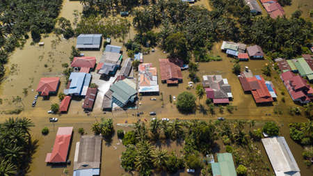 Bukit Changgang, Malaysia - Dec 21, 2021: Areal view of flooding that causes damage of the infrastructure and housing area. Selective focus, contains dust and grainのeditorial素材