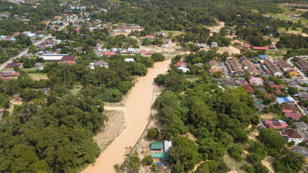 HULU LANGAT, MALAYSIA - DEC 22, 2021: Flood situation at Hulu Langat district that causes damage of the infrastructure and housing area. Selective focus, contains dust and grainのeditorial素材