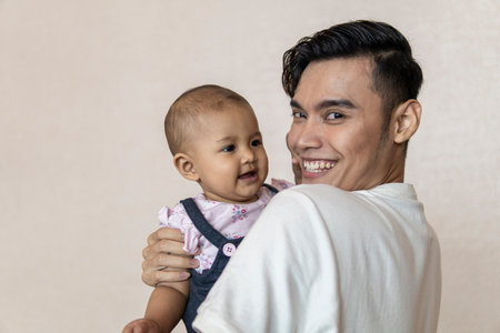 Family moment: Father and daughter moment on white backgroundの写真素材