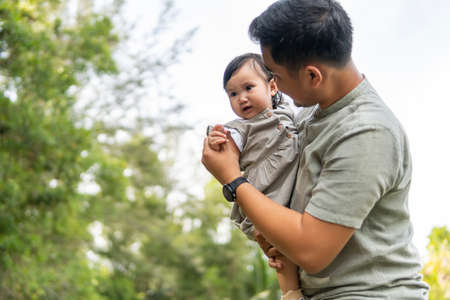 Family moment Father and daughter moment outdoor at the parkの写真素材