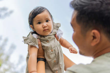 Family moment Father and daughter moment outdoor at the parkの写真素材