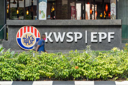 Kuala Lumpur, Malaysia - March 18, 2022: KWSP Employees provident fund, Malaysia's Prime Minister...