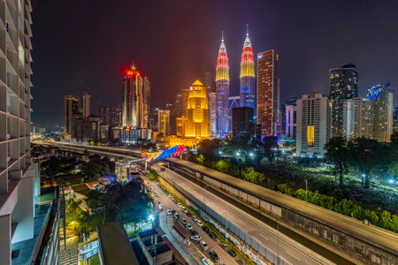 Kuala Lumpur, Malaysia - August 31, 2022 - Petronas KLCC Twin Tower building with the color of Malaysia flag during independence dayのeditorial素材