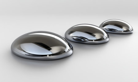 Three liquid metal droplets on white background; science, technology, or industrial conceptの素材