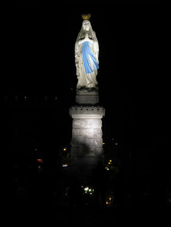 The beloved and crowned statue of Our Lady of Lourdes at the Marian Shrine of  Lourdes in France.の写真素材