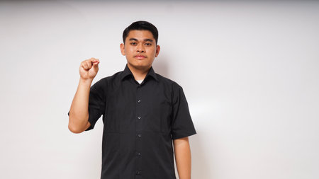 asian man is using sign language with hand. learn sign language by hand. ASL American Sign Languageの写真素材