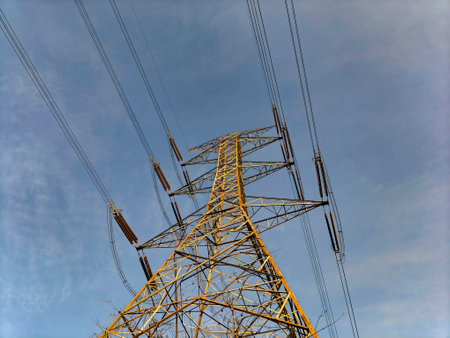 Telecommunications tower against blue sky
