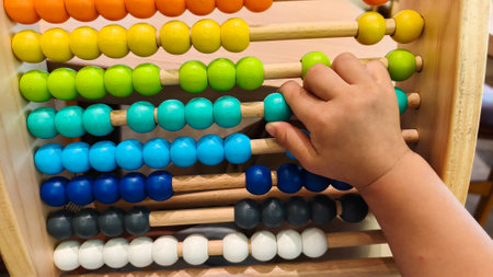 Little boy playing with abacus at psychologist's office. World Autism Awareness Dayの写真素材