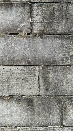 Old brick wall with green moss texture. Grunge background, weathered surface, natural decay, rustic...