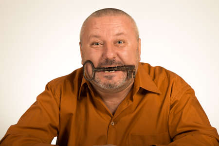 A man hold a key to success looking amazedの写真素材