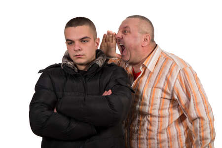 Father and son having an argument isolated on white backgroundの写真素材