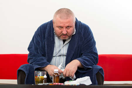 Adult man patient with cold and flu illness reliefの写真素材