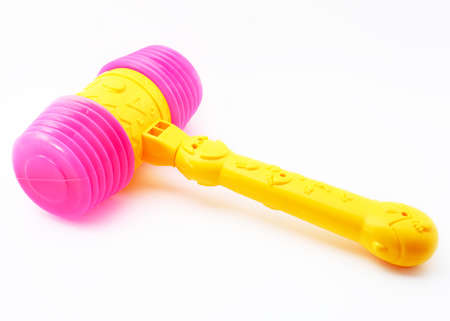 Kids toys - Plastic hammer over white background