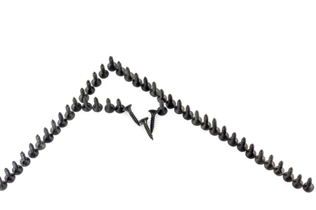 Mountain with a snow cap laid out with Oxidized self-tapping screw isolated on white backgroundの写真素材