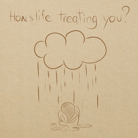 cartoon drawing of man sitting wet under the rainの写真素材