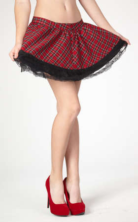 Woman s Legs Wearing Red Skirt and Heelsの写真素材