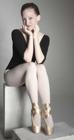 Ballerina Posing in a Studio Settingの写真素材