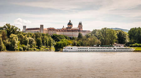 Melk Abbey, German: Stift Melk, with the Danube River and a boat Wachau Valley, Austriaのeditorial素材