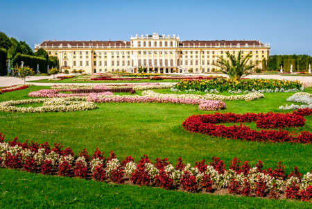 Schonbrunn Palace, German: Schloss Schonbrunn, and Great Parterre - French Garden with beautiful flower beds, Vienna, Austriaのeditorial素材