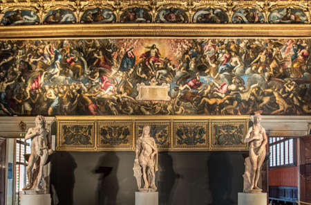 Venice, Italy - Oct 3, 2020: Interior of the Doge's Palace, the Sala dello Scrutinio. Fresco: Last Judgment of Jacopo Palma the Younger, 1595 - Statue: Mars, Adam and Eva of Antonio Rizzo, 1472のeditorial素材