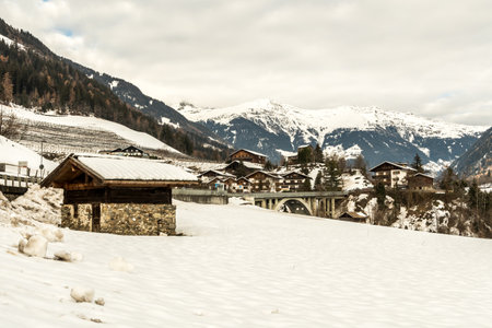 The small village San Martino in Passiria (St. Martin in Passeier in german) covered in snow, with alps mountains, South Tyrol, Alto Adige, SÃ¼dtirol, Italy.の写真素材