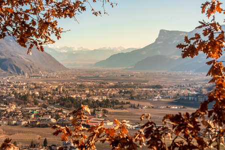 View to Merano (Meran) South Tirol and the Adige Valley heading (Bozen) in autumn with red leaves - Italy - SÃ¼dtirol - Alto Adigeの写真素材
