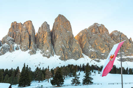 Odle mountains chain separating the Funes valley from the Gardena valley take from the Gaisler refuge with the South Tyrol flag, Italian Alps, Dolomites, Alto Adige, Sudtirolの写真素材