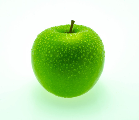 juicy green apple on a white backgroundの写真素材