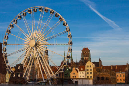 Ferris wheel on the background of the beautiful city of Gdansk. Polandのeditorial素材