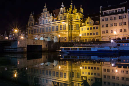 Ancient houses on the promenade of Gdansk at night. Poland