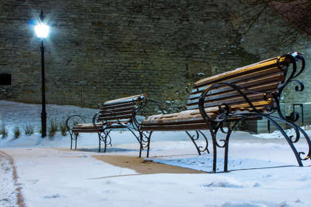 Benches in Tallinn night park. Estoniaの写真素材
