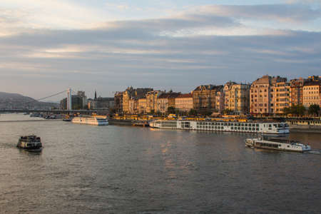 View of the Danube river embankment in Budapest at sunset. Hungary