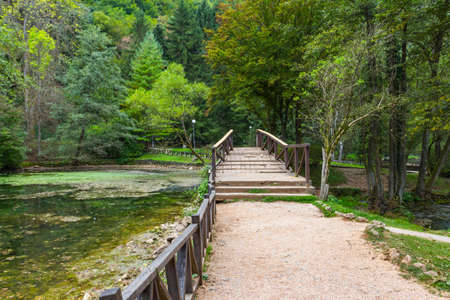 Wooden bridge in Vrelo Bosne Park in Sarajevo. Bosnia and Herzegovinaの写真素材