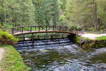 Wooden bridge in Vrelo Bosne Park in Sarajevo. Bosnia and Herzegovinaの写真素材