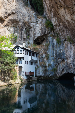 Beautiful view of the Dervish House under the rock in Blagaj. Bosnia and Herzegovinaのeditorial素材