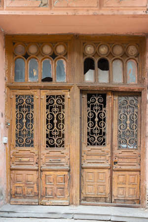 Ancient wooden door in a historic building in the Old Town of Tbilisi. Georgia countryの写真素材