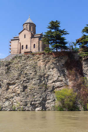 A view of the ancient Metekhi Church, built on the banks of the Mtkvari River in Tbilisi. Georgia countryの写真素材