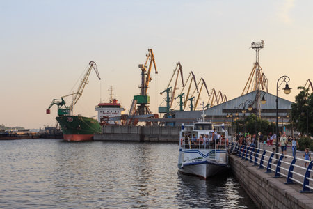 A cargo ship in the port of the city of Kherson at sunset. Ukraine. June 30, 2019のeditorial素材